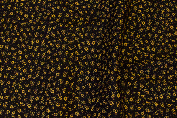 Black cotton with brass-yellow mini-flowers