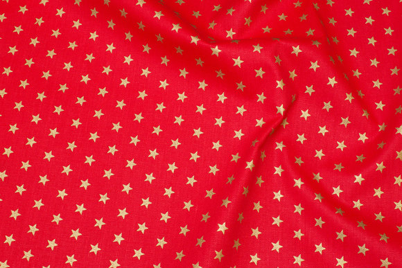 Rugged red deko-cotton with 1 cm gold stars