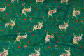 Green, light sweatshirt fabric with ca. 6 cm big deer