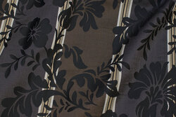 Brocade with black flowers on across-stripes in brown and charcoal