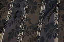 Brocade with black flowers on across-stripes in brown and charcoal