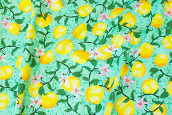 Green cotton-jersey with ca. 3 cm lemons