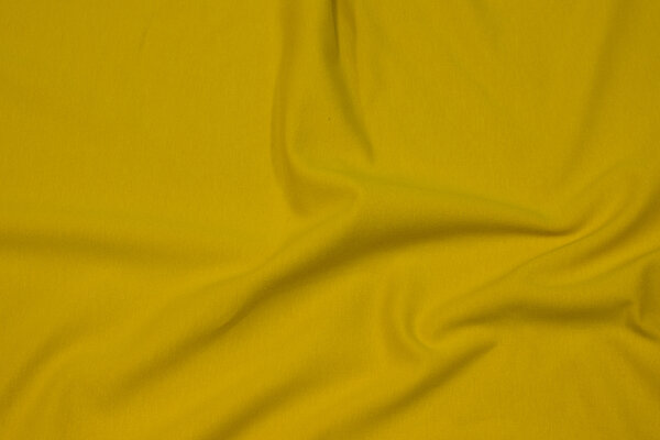 Light, softened sweatshirt fabric in brass-yellow