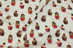 Off white cotton-jersey with ca. 3 cm big cupcakes