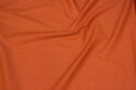 Rust-colored, firm cotton with lighter micro-dot