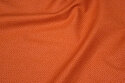 Rust-colored, firm cotton with lighter micro-dot